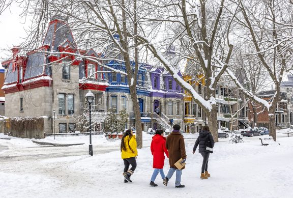 Montreal, snow, people walking, colorful houses