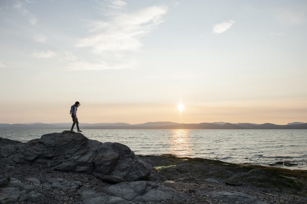 Silhouette by the sea, at sunset