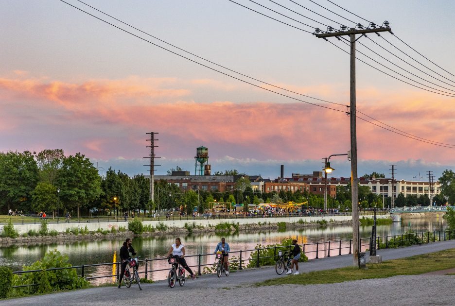 People on bikes along the Lachine Canal
