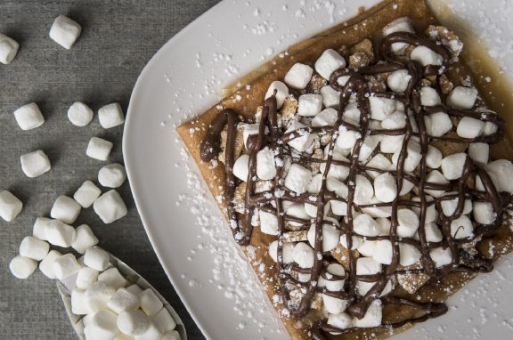 Pancakes with chocolate sauce and marshmallows