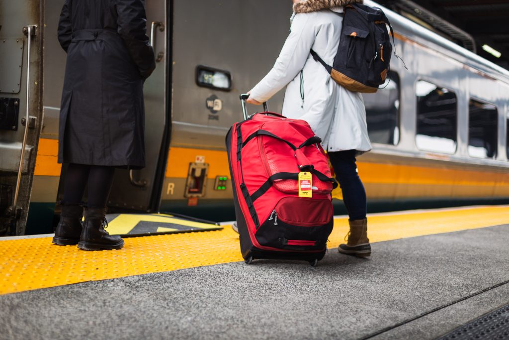 Woman getting on a via rail train in Ottawa