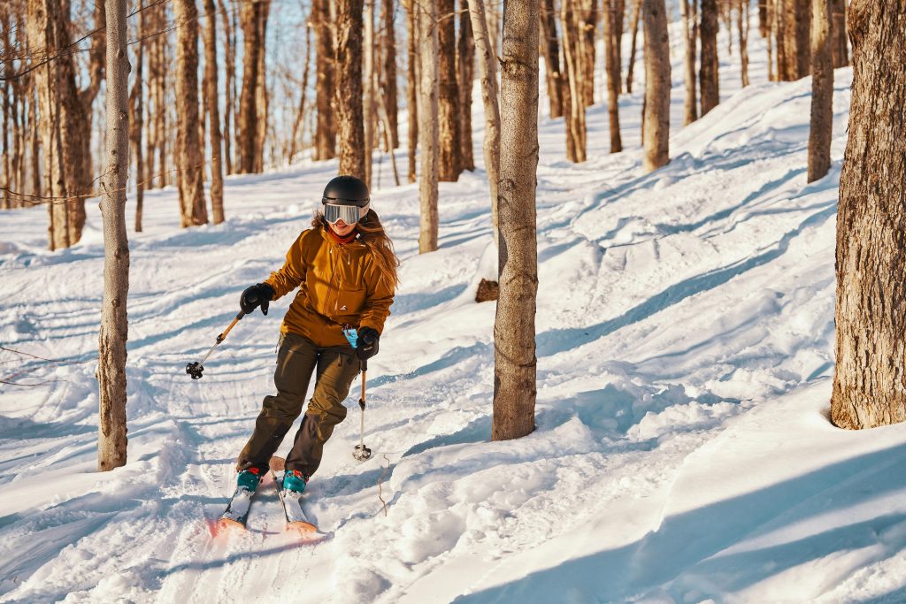 Woman skiing in a backcountry trail
