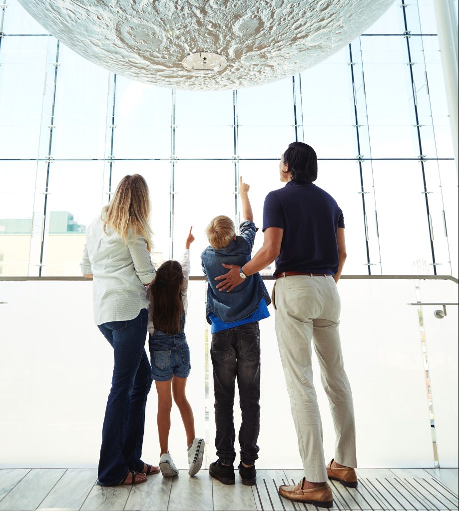 A family looking at a work of art