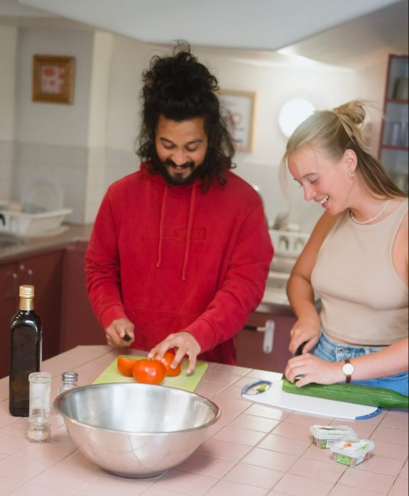 Two people cooking