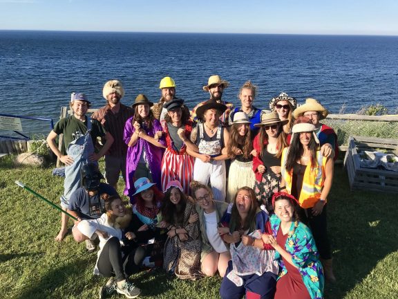 A group of friends in front of the sea, at Griffon Aventure