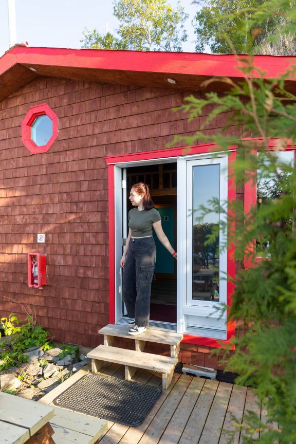 Person leaving a cabin at the Sea Shack