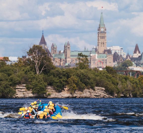 People on a fating in front of the Parliament of Ottawa.